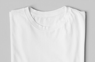 Folded men's crew neck t-shirt label mockup., closeup. - obrazy, fototapety, plakaty