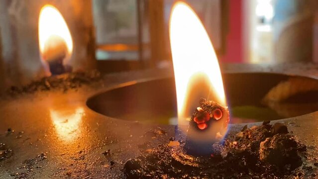 Flames under candlelight for worshiping sacred objects according to beliefs and culture in each country Region or religion, Flames under candlelight for worshiping gods, burning candle on background