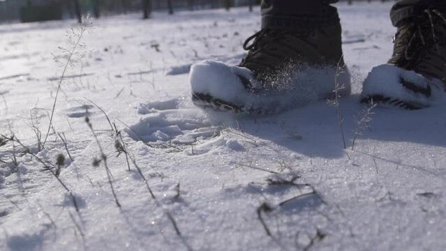 feet walking in deep snow shot in slow motion