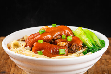 A bowl of pork knuckle noodles