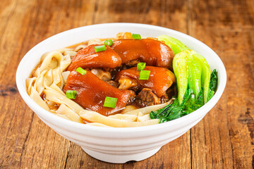 A bowl of pork knuckle noodles