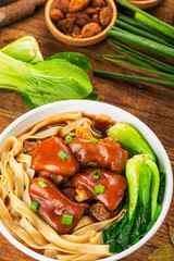 A bowl of pork knuckle noodles