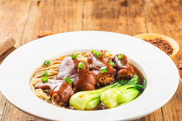 A bowl of pork knuckle noodles