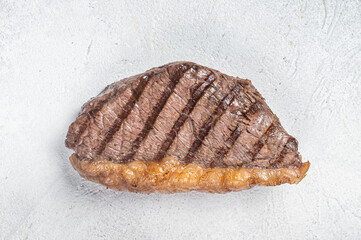 Fried and sliced Top sirloin steak, Grilled cup rump beef meat steak. White background. Top view. Copy space