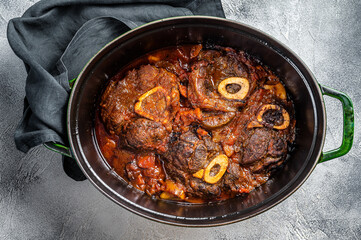 Osso buco cross cut veal shank braised with tomatoes and spices, beef meat Ossobuco. White background. Top view
