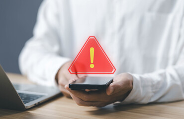 smartphone shows a warning sign of system failure, notification spam. concept caution danger if a...