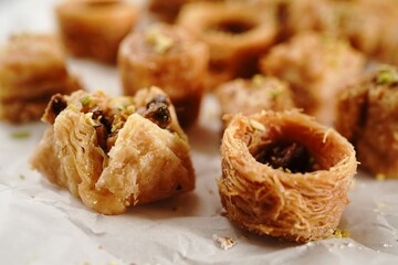 Assorted Baklava or baklawa topped with nuts, selective focus