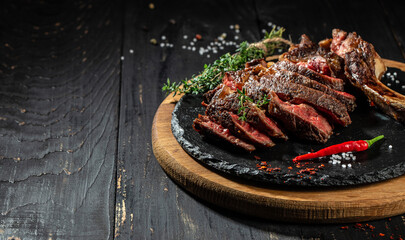 grilled beef barbecue Striploin steak on cutting board. Long banner format. top view. copy space for text