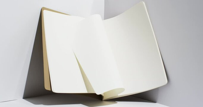 Video of book with white blank pages and copy space on white background