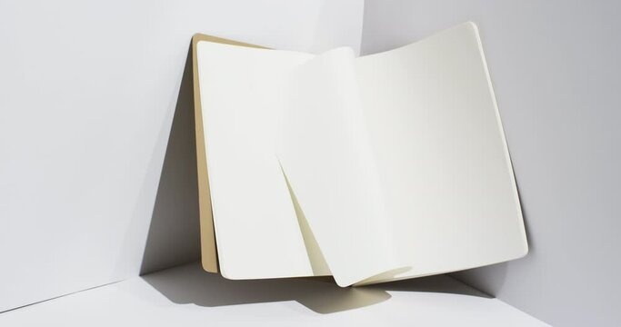 Video of book with white blank pages and copy space on white background