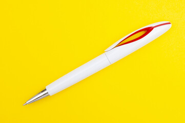 Elegant pen close up  on a yellow background