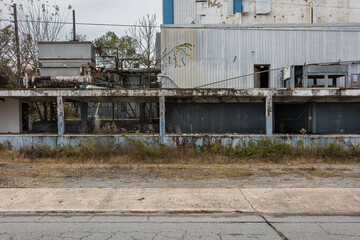 Side of abandoned ice making factory left to rot in the deep south