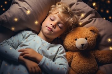 Cute little boy sleeps tight with teddy bears in comfortable bed at night. Adorable toddler kid with stuffed toys and pillows naps in bedroom. Healthy child rests after active day in children room