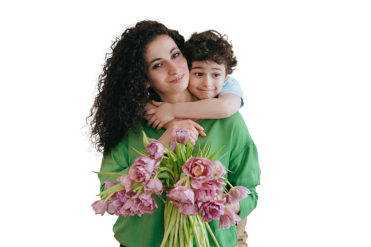 Happy young woman holding bouquet smiles enjoying hugs from little son against transparent background. Mothers day, childhood. Handsome little kid embracing mom with love, family.