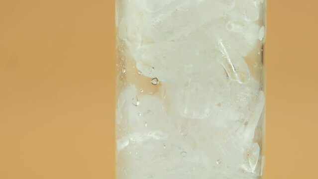 Close up of ice cubes in a tall glass, Ice in transparent glass, water in transparent glass