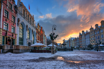 Sunrise in the historic center of Gdansk with the Neptune fountain at winter, Poland.