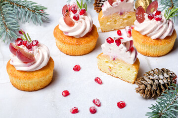 Traditional Christmas cottage cheese cupcakes. Decorated with fir branches and Christmas decorations. Copy space. High key