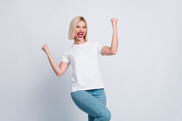 Photo of optimistic crazy girl with bob hairdo dressed white t-shirt yell win betting raising fists...