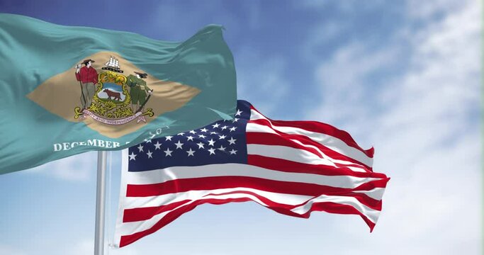 Delaware state flag waving with the national american flag