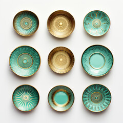 panel of ceramic plates of luxurious turquoise color with gold painting on a white background