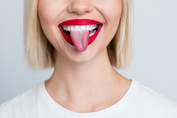 Close up cropped photo of cheerful positive girl showing white bright smile teeth tongue isolated on grey color background