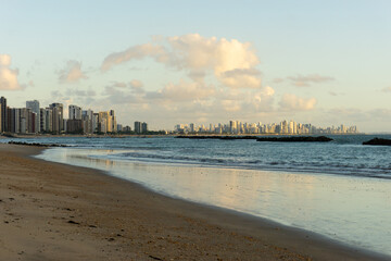 At the Beach of Candeias early in the morning, just after sunrise. The City of Recife, Brazil is to see in the background