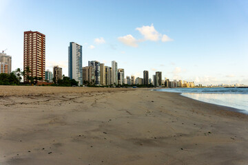 Apartment Buildings are mirroring at the Beach of Candeias early in the morning, just after...