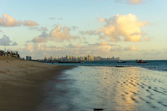 At the Beach of Candeias early in the morning, just after sunrise. The City of Recife, Brazil is to see in the background