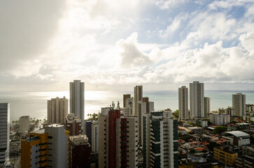 Fototapeta na wymiar Apartment Buildings in Candeias, Brazil on a cloudy and rainy morning in direction of the Sea.