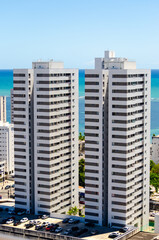 A twin Tower Building in Candeias, Brazil at the Beach on a sunny day