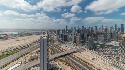 Naklejka premium Panorama showing skyline of Dubai with business bay and downtown district timelapse.