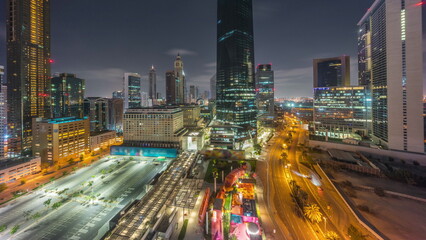 Dubai International Financial district aerial all night timelapse. Panoramic view of business and...