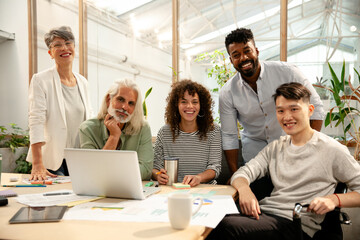 Group of coworkers looking at the camera during meeting