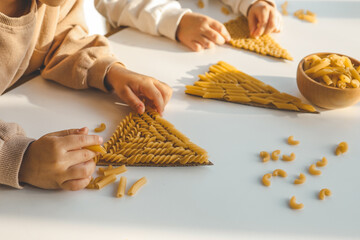 Idea for activities with children, sensory skills, creativity with pasta - obrazy, fototapety, plakaty
