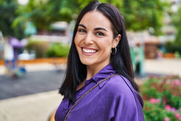 Young beautiful hispanic woman smiling confident standing at park