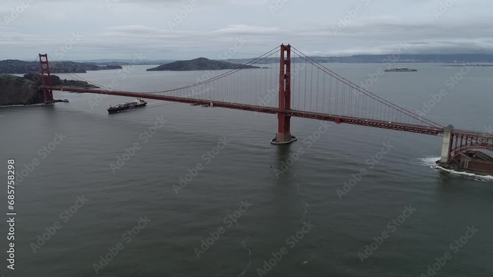 Sticker Golden Gate Bridge in San Francisco, California. Cloudy Sky. Alcatraz Island and Prison In Background. USA. Drone