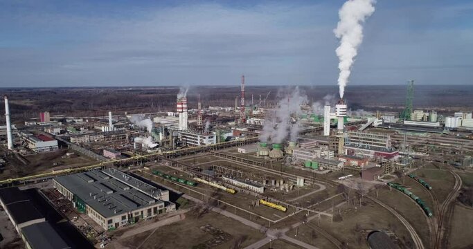 Chemistry Factory in Lithuania, Achema in Jonava City. Clear Blue Sky and Smoke Stacks in Background. Drone