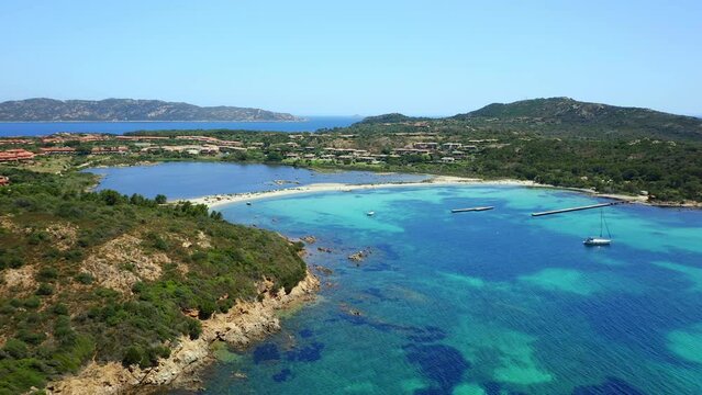 Drone aerial view of Salina Bamba beach with Isola Molara islet on the background in Sardinia, Italy