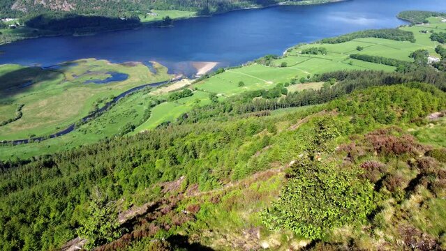 A Stunning Drone Shot Flying from a Mountainside of Dodd Hill Panning up to Reveal Bassenthwaite Lake in the Lake District UK