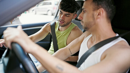 Fototapeta na wymiar Two men couple driving car at street
