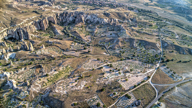 Panoramic view of fairy chimneys in Goreme Historical National Park. Goreme National Park and Rock Sites of Cappadocia, Central Anatolia, Nevsehir Province, Turkey. drone view. Ariel from above, top