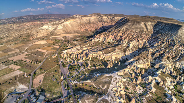 Panoramic view of fairy chimneys in Goreme Historical National Park. Goreme National Park and Rock Sites of Cappadocia, Central Anatolia, Nevsehir Province, Turkey. drone view. Ariel from above, top