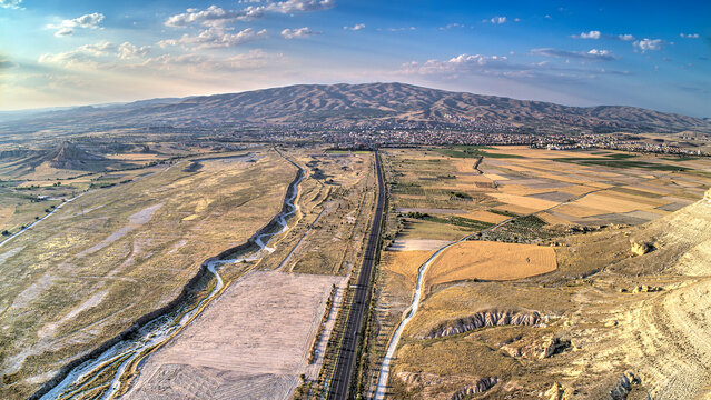 Panoramic view of fairy chimneys in Goreme Historical National Park. Goreme National Park and Rock Sites of Cappadocia, Central Anatolia, Nevsehir Province, Turkey. drone view. Ariel from above, top