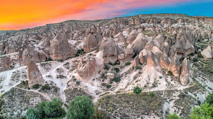 Panoramic view of fairy chimneys in Goreme Historical National Park. Goreme National Park and Rock Sites of Cappadocia, Central Anatolia, Nevsehir Province, Turkey. drone view. Ariel from above, top