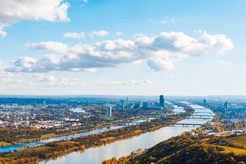 Panoramic view from a vineyard hill over the Danube River in Vienna, Austria. Donaustadt is the district of Vienna, Austria. Danube with  Bridge, skyscrapers and business centres in Vienna, Austria.