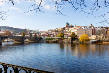 Snowy Prague Lesser Town with Prague Castle above River Vltava in the sunny Day , Czech republic