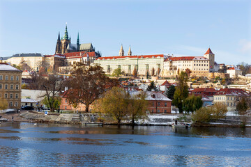 Fototapeta premium Snowy Prague Lesser Town with Prague Castle above River Vltava in the sunny Day , Czech republic