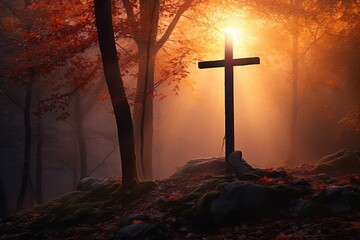 Cross in the forest with sun rays coming through the trees