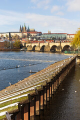 Obraz premium Snowy Prague Lesser Town with Prague Castle above River Vltava in the sunny Day , Czech republic
