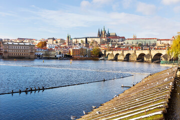 Obraz premium Snowy Prague Lesser Town with Prague Castle above River Vltava in the sunny Day , Czech republic